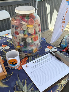 Guess the number of bottle caps in the jar at Paddle Out Plastic tabling event