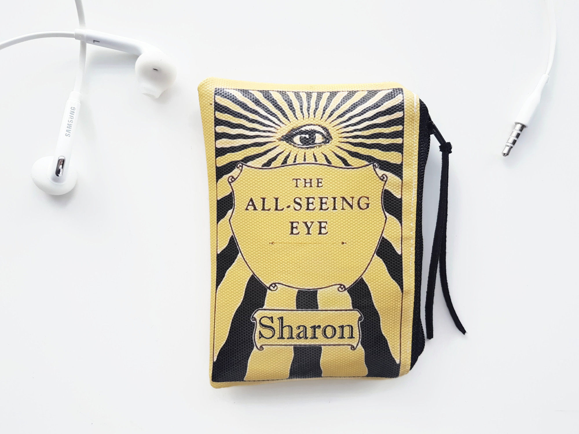 The all seeing eye, earphone, lipstick wallet.