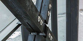 Exposed dark wood cross bracing is featured prominently in 2750 Richter Street, a mixed use development by Worman Commercial