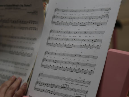 Music In Me sheet music on a pink piano.
