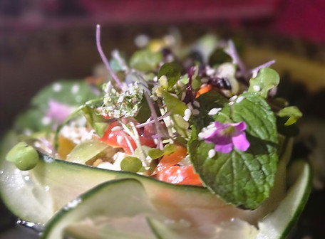 Image of Course III — Freshness Heaven at Hidden Gazebo Eatery Cherry tomatoes, feta, and fresh mint nestled inside a cucumber ribbon. Light, bright, and finished with microgreens and edible flowers.