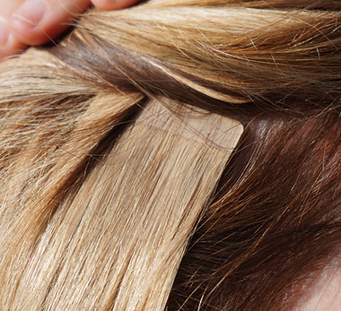 hair extensions in blond girl, womans hair, professional from hairdresser, tape in extens