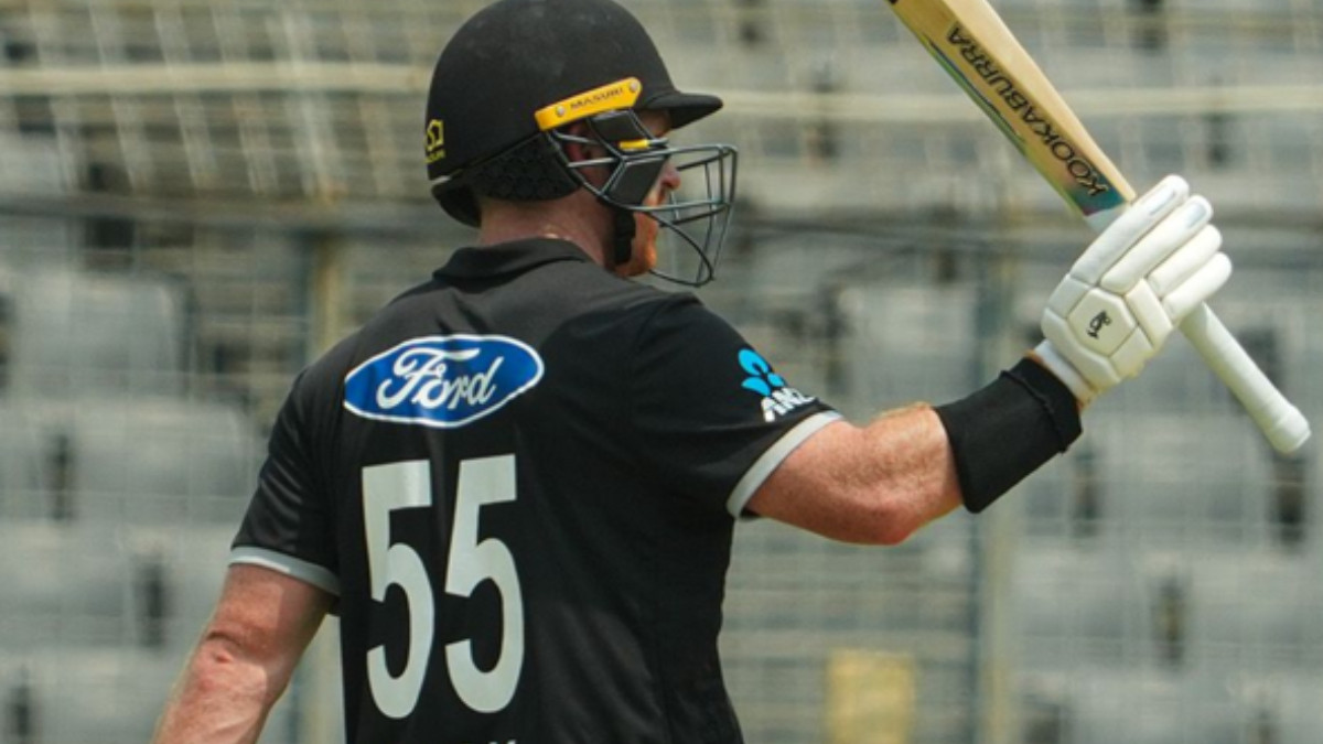 A Black Caps batsman walking off the field