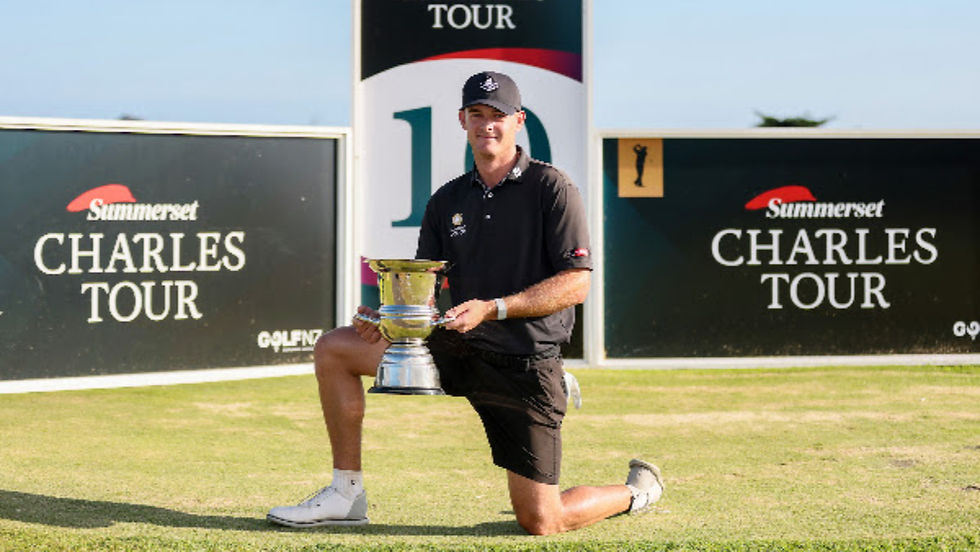 Tyler Wood with the trophy at the Muriwai Golf Open on the Chalres Tour PHOTO: BW MEDIA