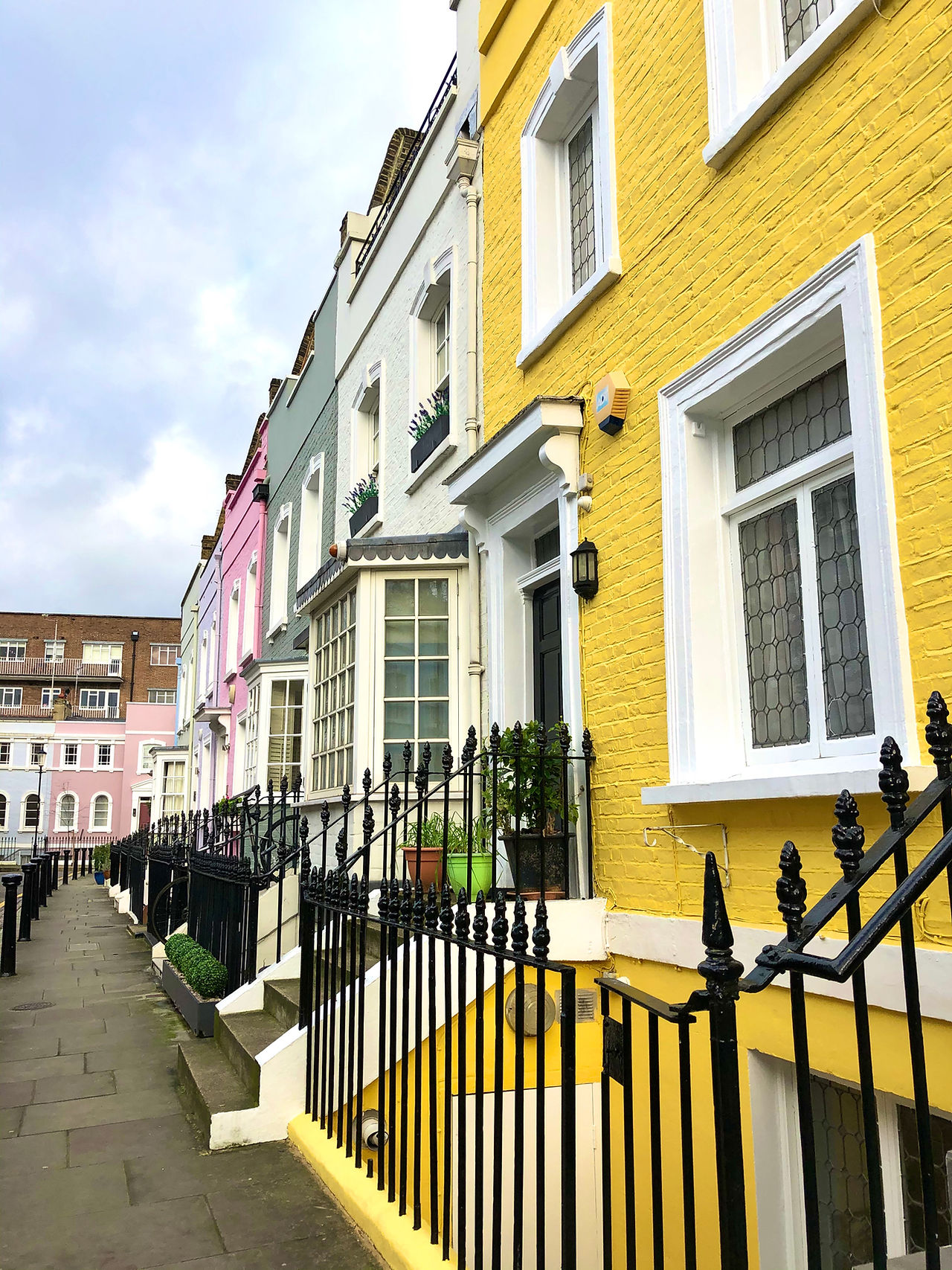 A row of bright coloured houses in Chelsea in London