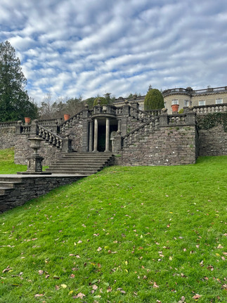 View of the back of Rydal Hall from the garden on a clear day in the Lake District