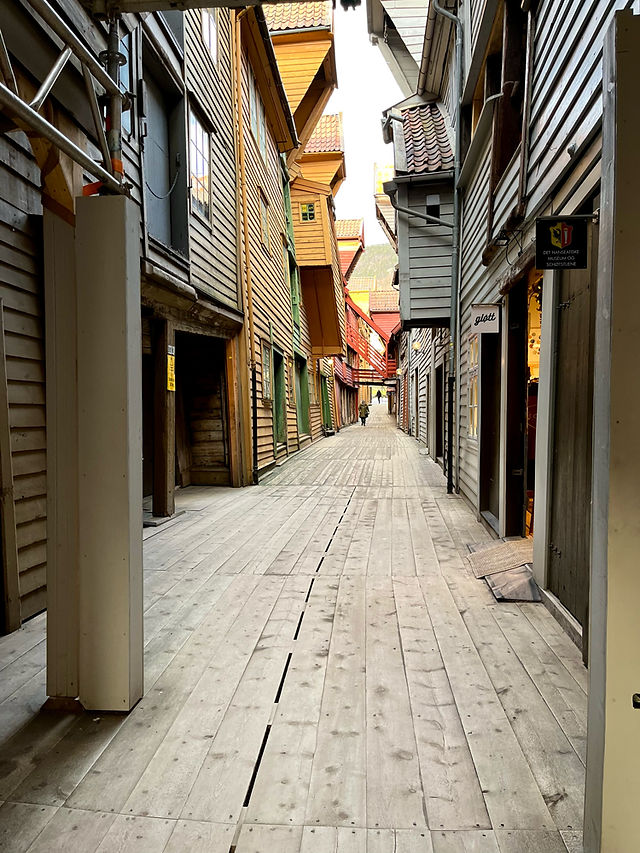 Walking in between the alleys in Bryggen in Norway