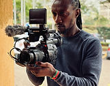 Elijah-Kanyi-with-his-camera_edited.jpg