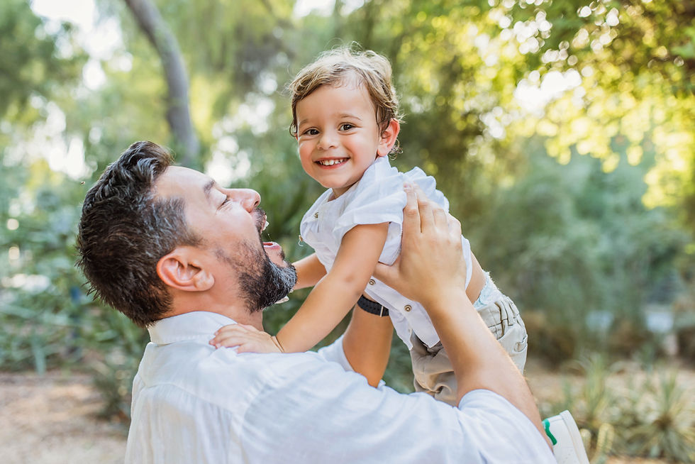A maternity photo session with a toddler at Umm Al Emarat Park | Abu Dhabi Family Photographer