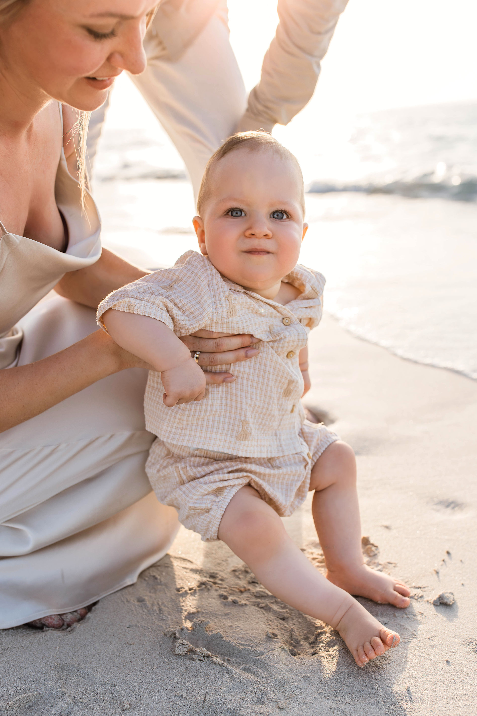 baby sitting on the beach in Abu Dhabi