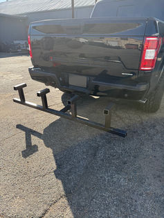 Empty hitch-mounted safety cone rack designed for security and industrial vehicles