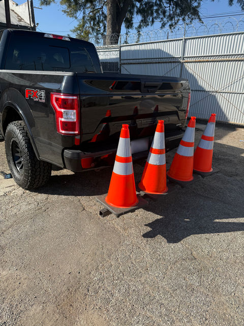 Private security vehicle using a hitch-mounted safety cone rack at a port facility in Los Angeles and Long Beach