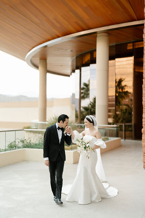 Bride and groom standing on outdoor veranda at Red Rock Resort, Las Vegas