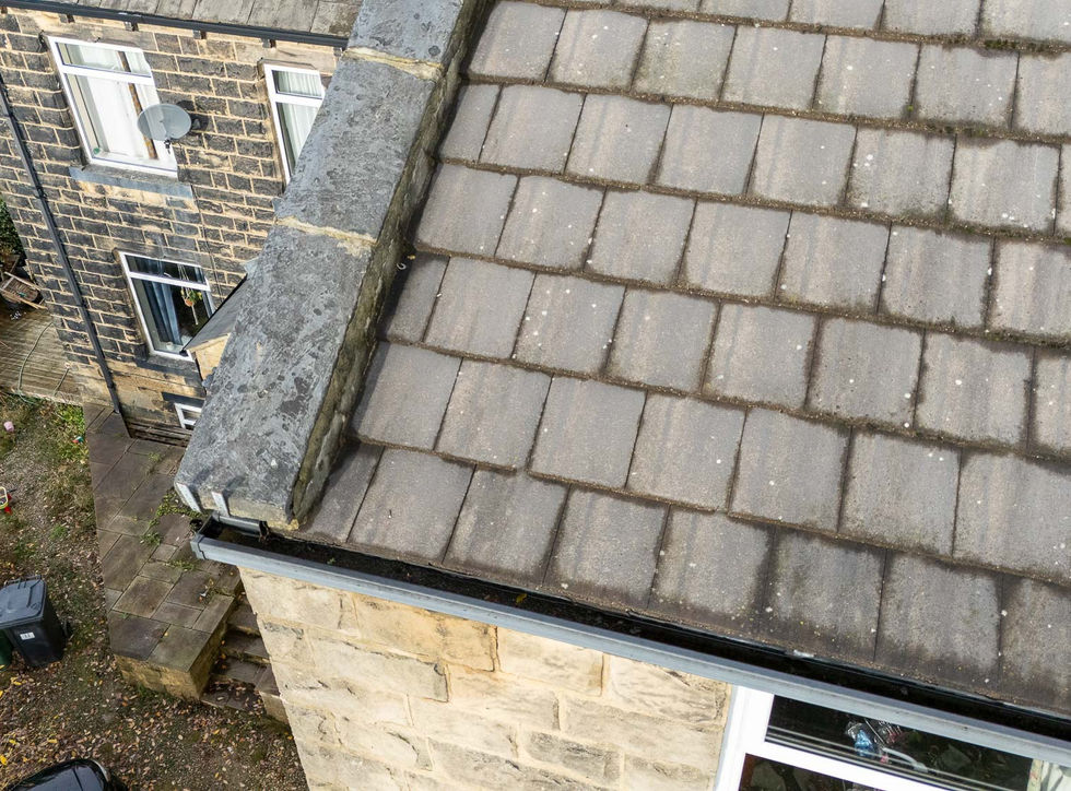 Aerial drone photograph showing the full roof of a North Leeds end-terrace property, captured to identify sources of water ingress.
