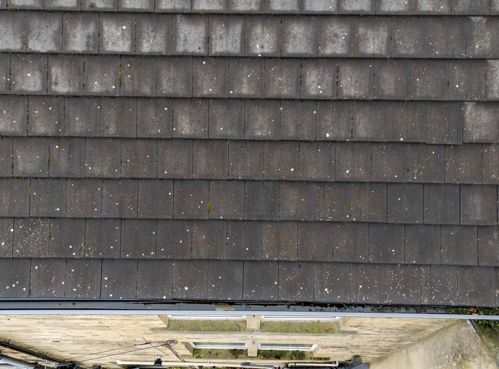 Aerial drone photograph showing the full roof of a North Leeds end-terrace property, captured to identify sources of water ingress.