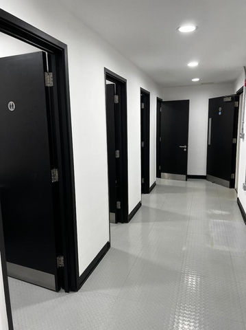 corridor with black doors fitted