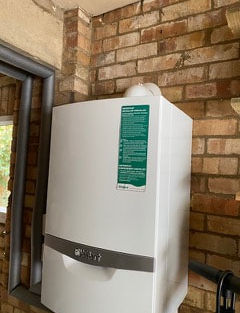 Gas boiler on brick wall