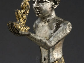 STATUE OF A RAMESSIDE KING OFFERING MAAT