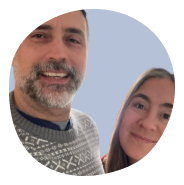a husband with a gray beard and short hair with a wife with long brown hair