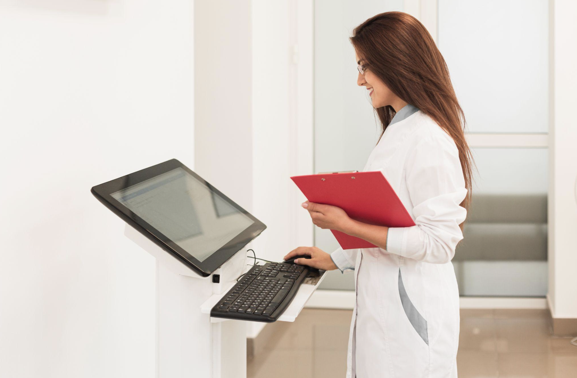 Medical staff using AI software for scheduling and billing, showcasing administrative automation in mid-sized healthcare.