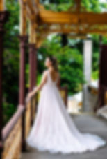Back view of ‘islands in the stream’ PF323 by Purple Fox Bride featuring detailed lace back and sweeping train