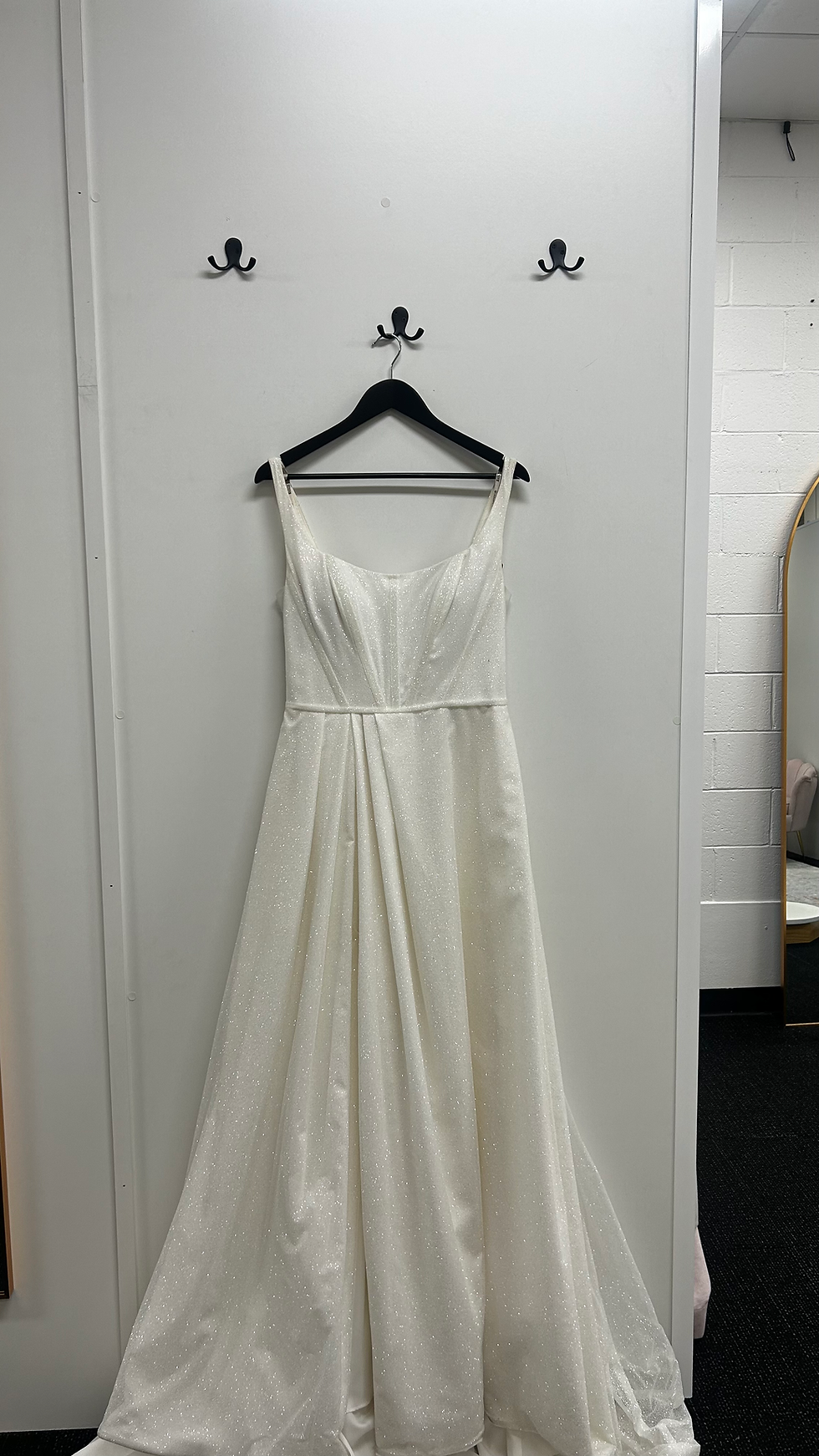 Front view of a full glitter ivory A-line Maggie Sottero wedding dress from the Brides by Francesca One Only collection.