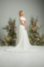 Back view of ‘Time to Remember’ by Jean Fox bridal gown showcasing button detailing flowing through the back and elegant A-li