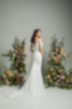 Back view of ‘Vienna Waits’ J208 by Jean Fox bridal gown showcasing the flattering V-back and elegant button detailing.