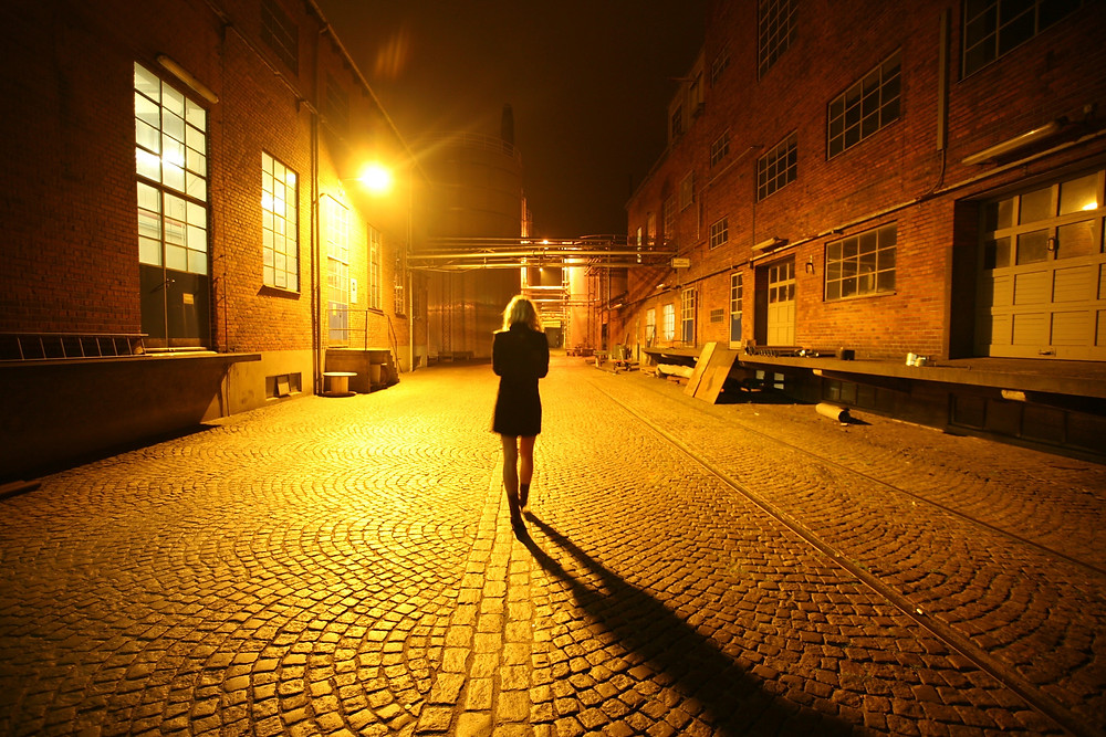woman walking alone at night