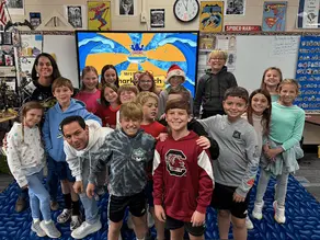 Drone Legends Founder, Scott Buell with a team of Drone Legends students and their STEM Teacher.