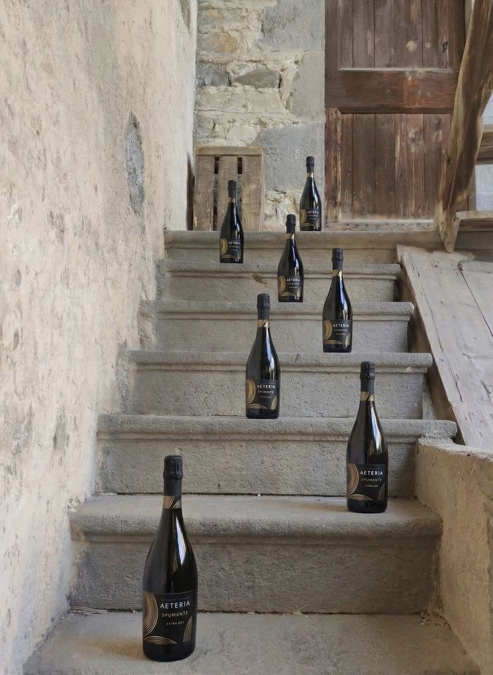 AETERIA bottles on old stone steps