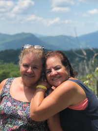 A picture of twin sisters outdoors