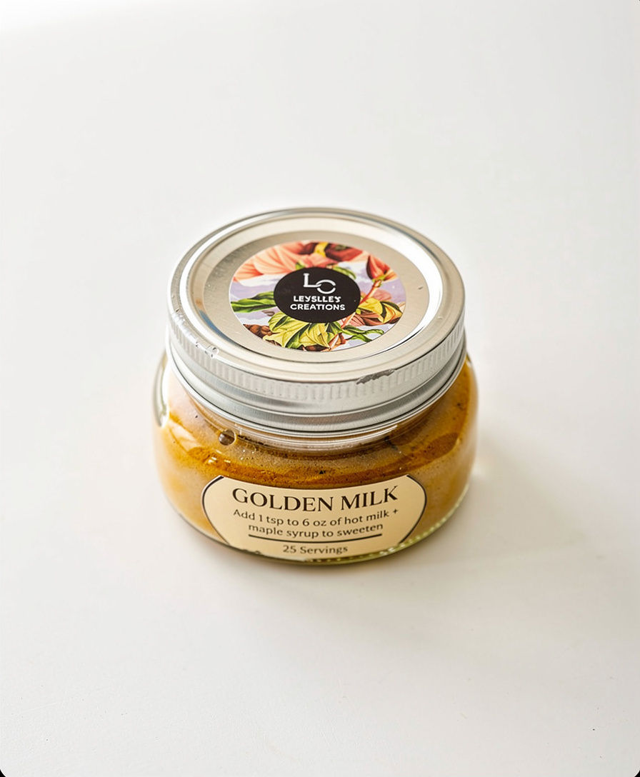Small glass jar of Golden Milk Elixir with a silver lid.