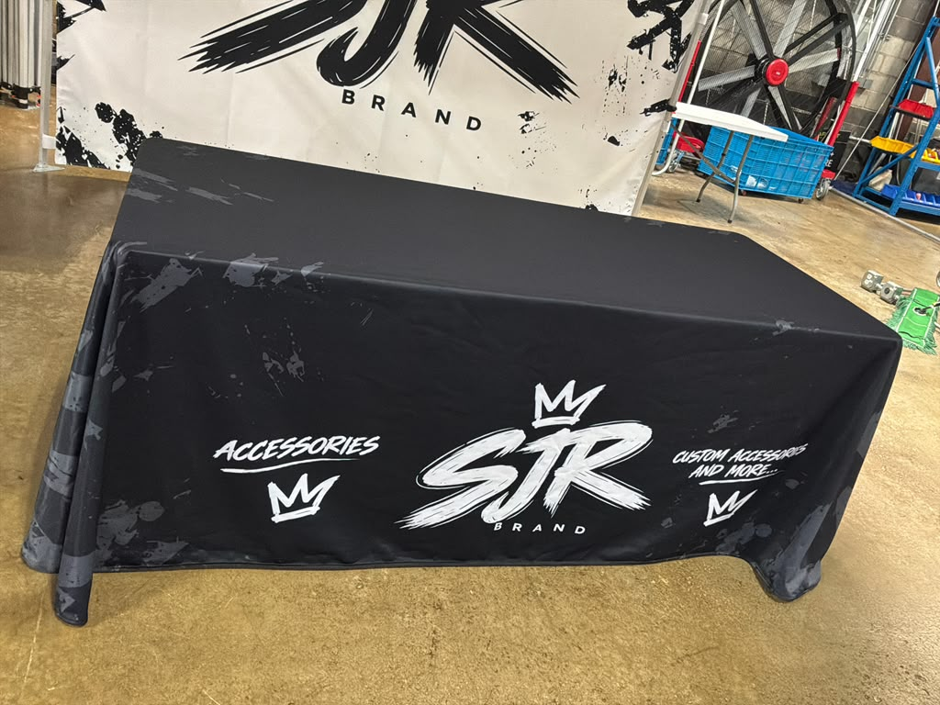 Custom 10x10 canopy tent for business events in Mesquite TX with a 6ft table cover with logo