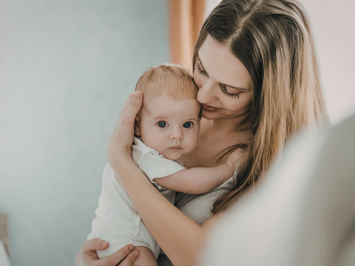 mother holding baby