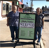 Vaccine staff with sign