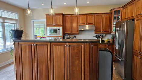 Kitchen fully unpacked and organized, with everything in place and ready to use. Boxes have been broken down and removed.