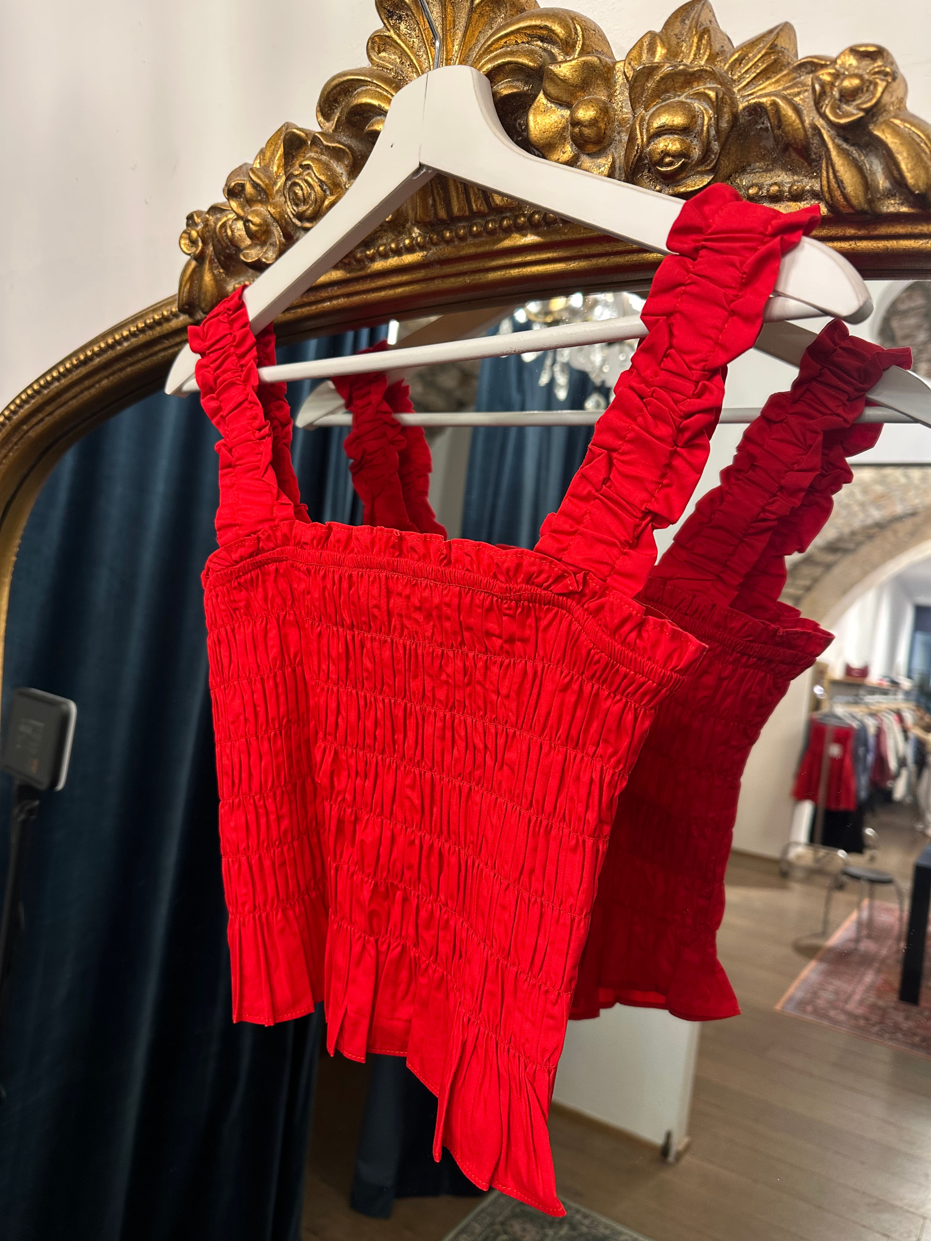  Top rosso goffrato con bretella