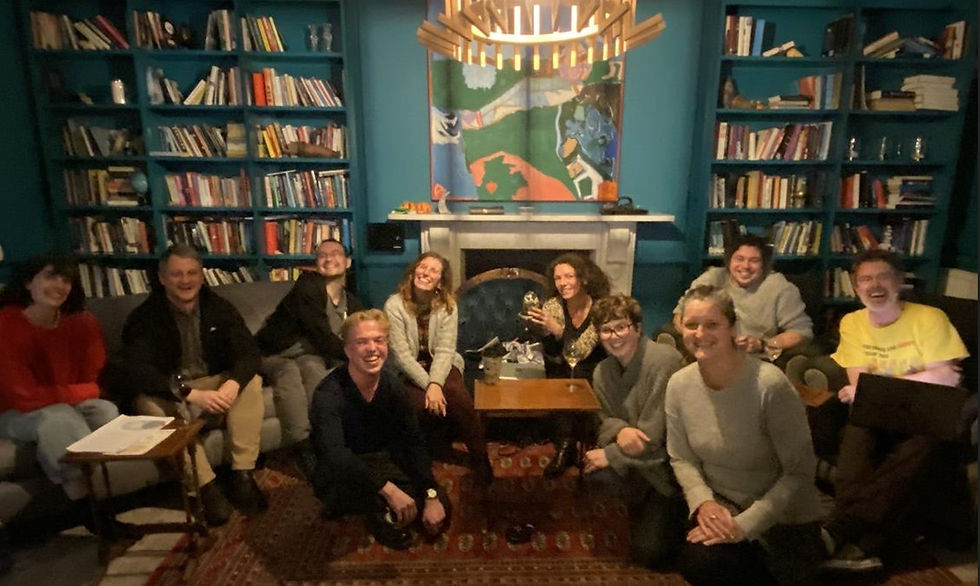 ARTICLE 3: Feature image showing the lecturers and student writers sat together following the successful performance of their script.