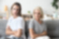 Upset older mother in law and adult daughter sit back to back not talking after fight disa