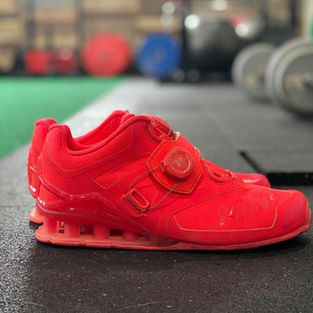 Used for Olympic Lifting. Note the elevated heel - this is necessary for the deep squat positions required in Olympic lifts. Even with this elevated heel, it is still considered "flat" and solid as compared to the cushion of a running shoe.