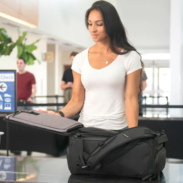 woman with luggage at airport