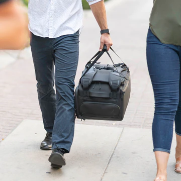 man carrying luggage