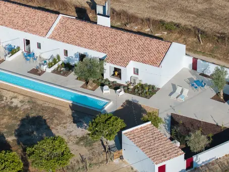 White Alentejo farmhouse with a long pool in golden countryside