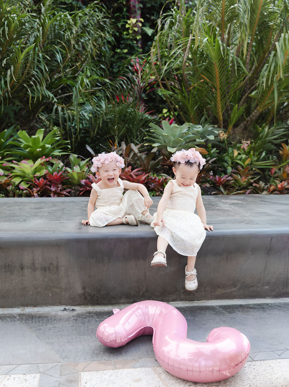 Twin siblings enjoying their birthday photoshoot in Singapore