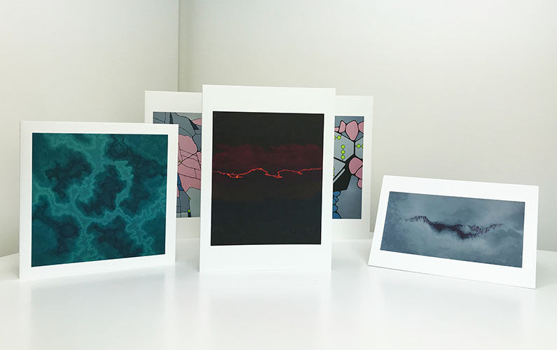 Thumbnail: Group of greetings cards by Heidi Hodkinson, black, teal and grey abstract art cards at front