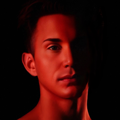 Waymon Hudson in dramatic red lighting, half his face in shadow and half illuminated, creating a bold, intimate mood — cover-style portrait for Through My Skin album.