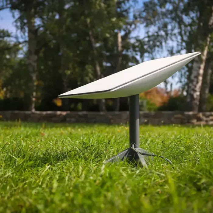 Starlink satellite internet dish set up on green grass in Costa Rica, representing reliable backup internet options for remote workers and digital nomads.