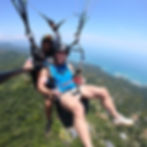 Expat life in Costa Rica — paragliding high above the jungle and Pacific Ocean near Dominical. Adventure activities like paragliding, surfing, and hiking make Costa Rica a paradise for thrill seekers, digital nomads, and LGBTQ expats chasing the Pura Vida lifestyle