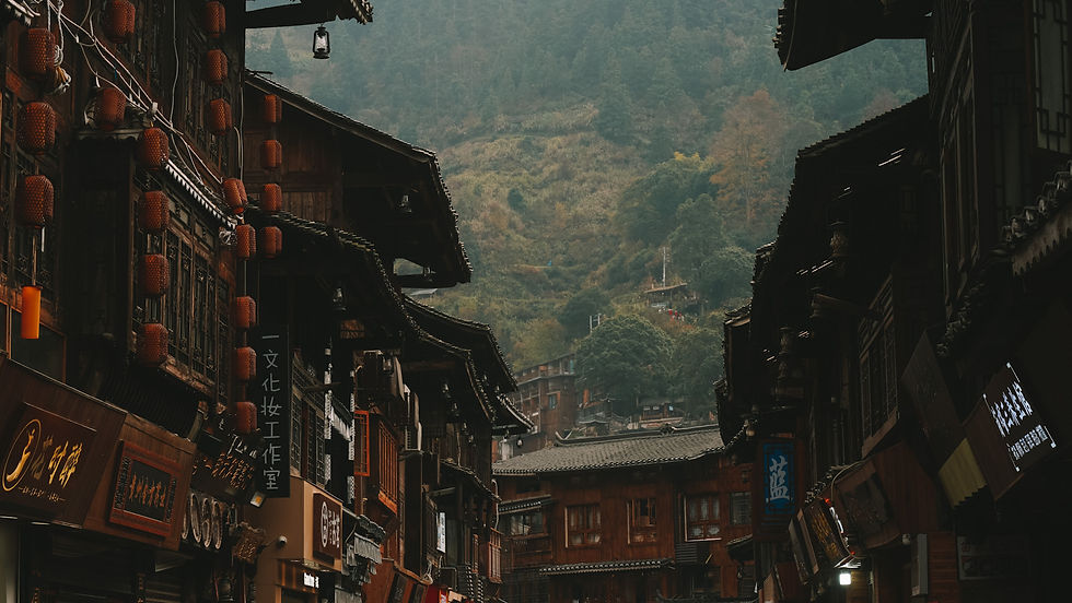 Street with traditional wooden buildings in Xijiang Qianhu Miao Village, Guizhou, China
